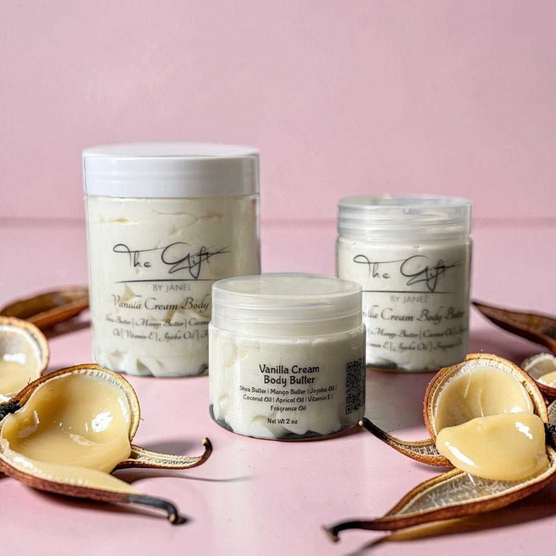 Vanilla cream body butter jars with vanilla beans on a pink background