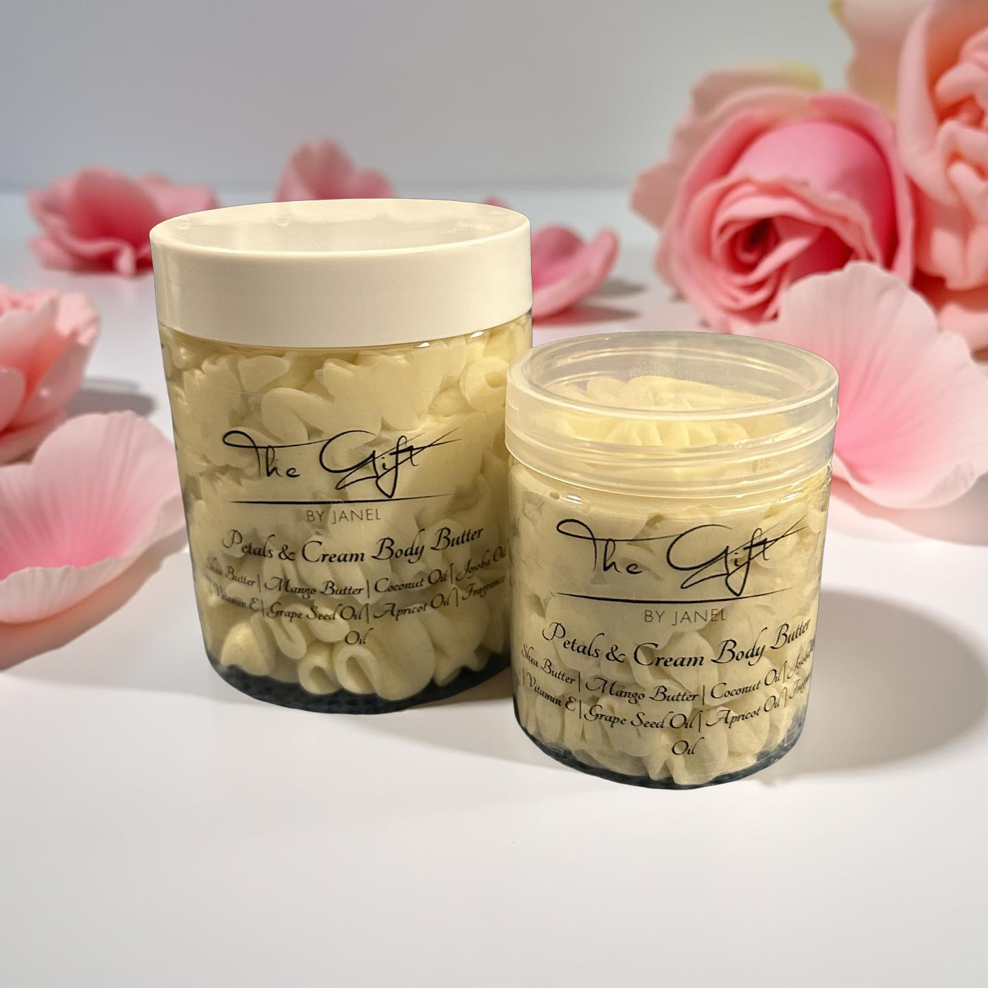 Two jars of 'Petal & Cream Body Butter' with pink flowers in the background