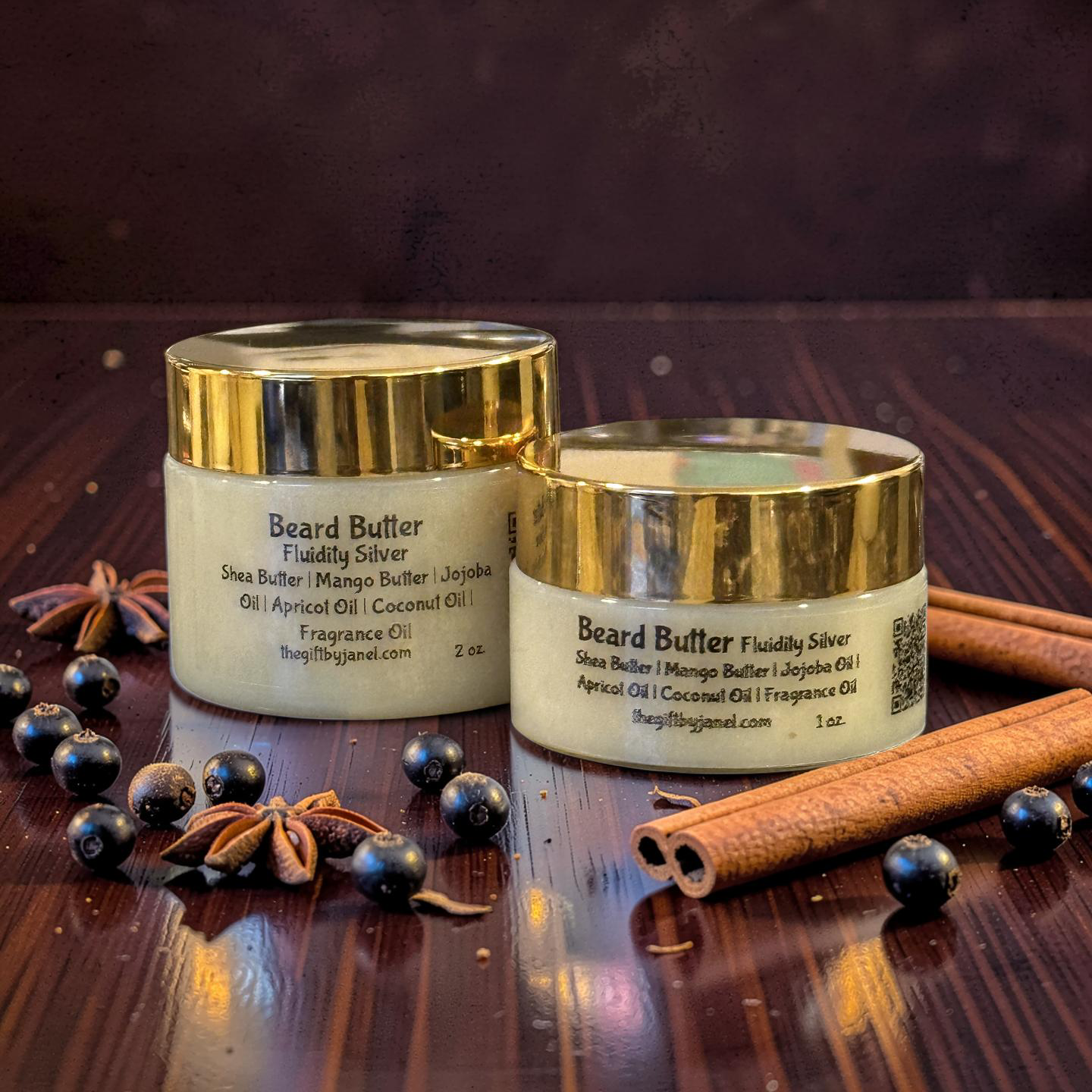 Two jars of beard butter with gold lids on a wooden surface with spices.