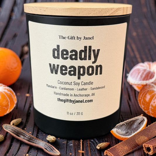 Candle labeled 'deadly weapon' with decorative elements on a wooden background