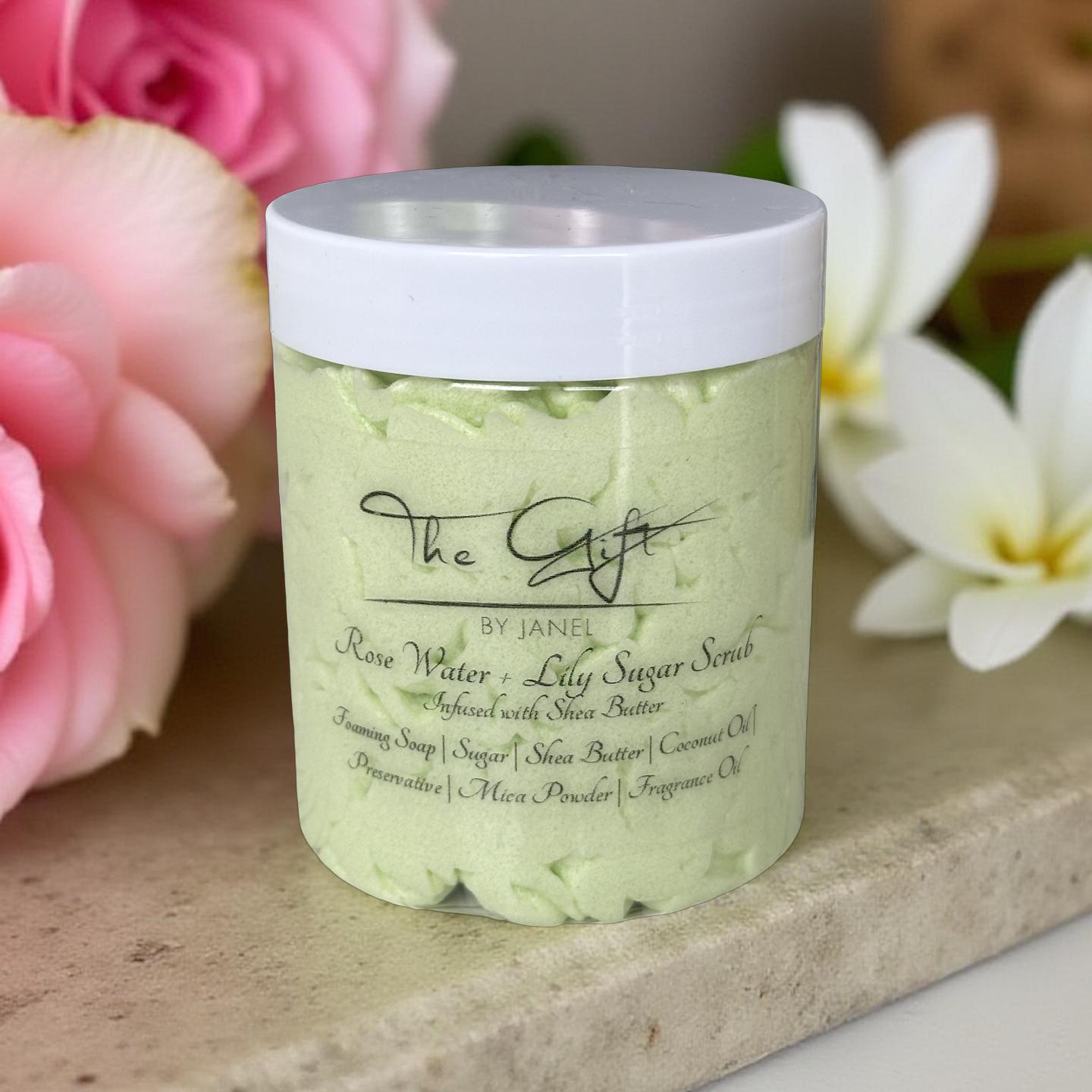 Jar of Rose Water + Lily Sugar Scrub with flowers in the background