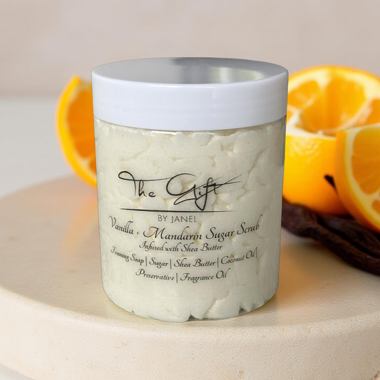 Jar of Vanilla Mandarin Sugar Scrub with oranges in the background